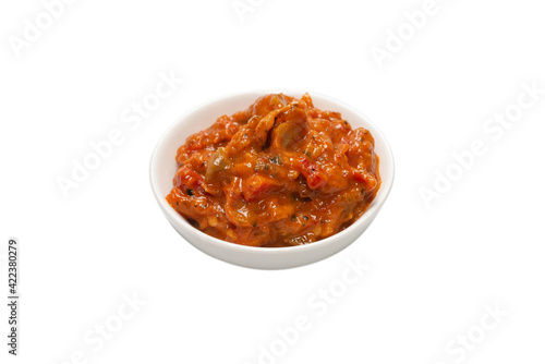 Vegetable stew in a bowl isolated on white background.