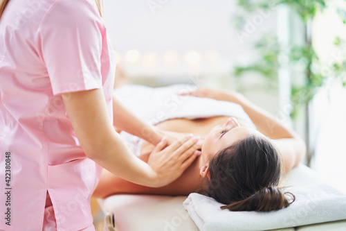 Adult woman during relaxing massage in spa