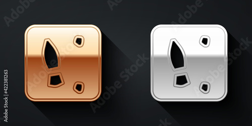 Gold and silver Human footprints shoes icon isolated on black background. Shoes sole. Long shadow style. Vector