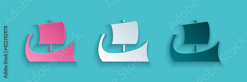 Paper cut Ancient Greek trireme icon isolated on blue background. Paper art style. Vector