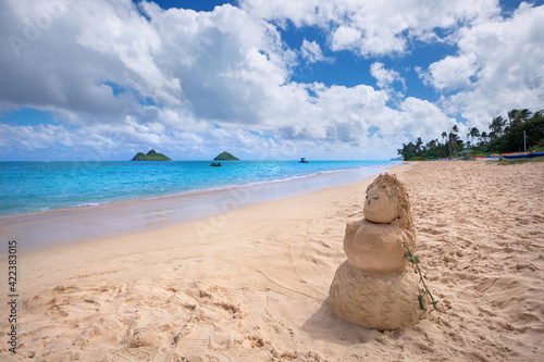 sandy woman on Lanikai Beach and Mokulua Islands, O'ahu, Hawai'i