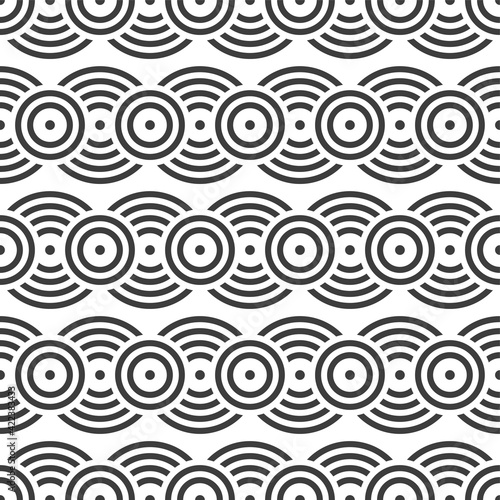 Seamless pattern. Overlapping circles. Geometric ornament. Repeating round shapes. Vector monochrome background.