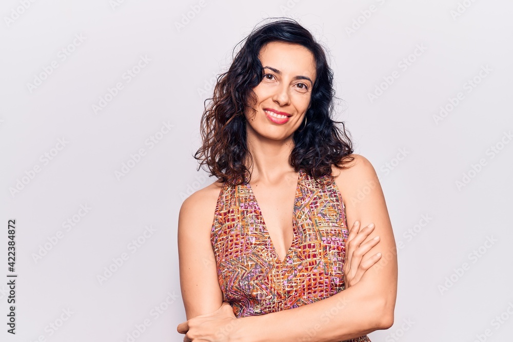 Young beautiful hispanic woman wearing casual clothes happy face smiling with crossed arms looking at the camera. positive person.