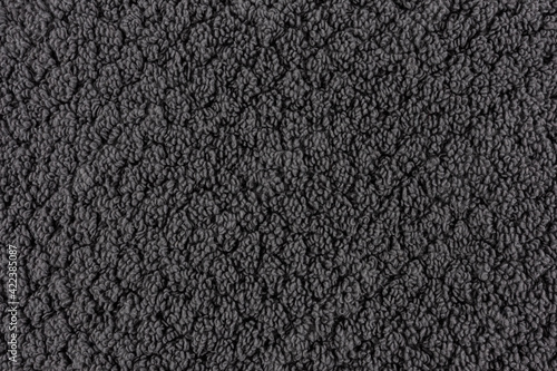 Closeup of a dark grey towel. textile details backdrop