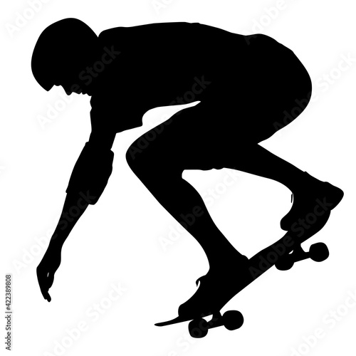 Black silhouette of an athlete skateboarder in a jump