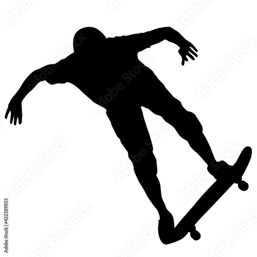 Black silhouette of an athlete skateboarder in a jump