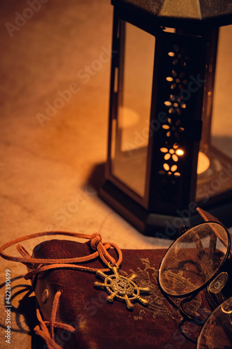 lantern with candle and book