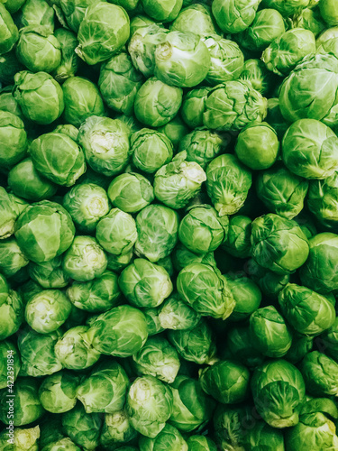 Brussel sprouts Close up photo pattern in top view Heap of fresh green cabbage sprouts in supermarket