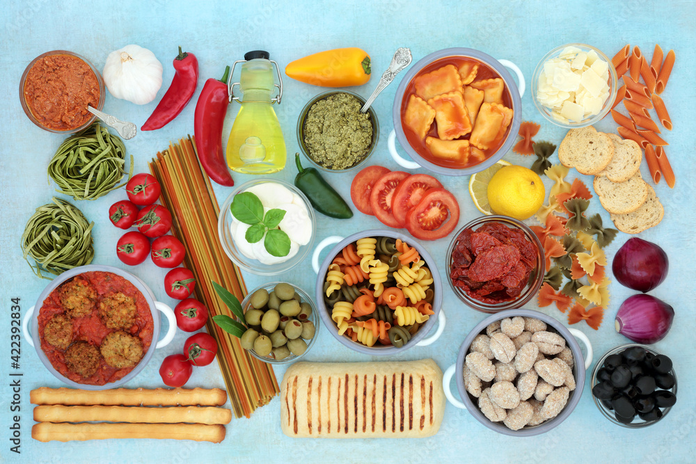 Italian health food for a healthy diet high in antioxidants, anthocyanins, fibre omega 3 & protein. With meatballs, cheeses, vegetables, pasta, sauces, bread products & herbs. On mottled blue. Italian health food for a healthy diet high in antioxidants, anthocyanins, fibre omega 3 & protein. With meatballs, cheeses, vegetables, pasta, sauces, bread products & herbs. On mottled blue.