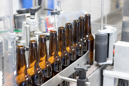 BEER BOTTLES ON A CONVEYOR BELT