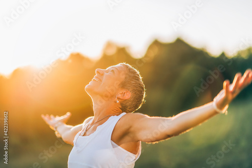 Embracing the positive energy with open arms photo