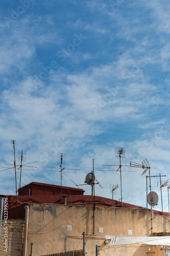 Rooftops with antennas in the countryside of a village in Spain