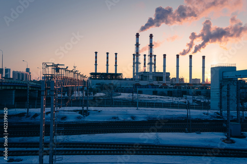 Fotografie Railway tracks and thermal power station in the morning