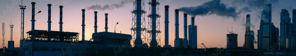 Silhouette of a thermal power station in the early morning