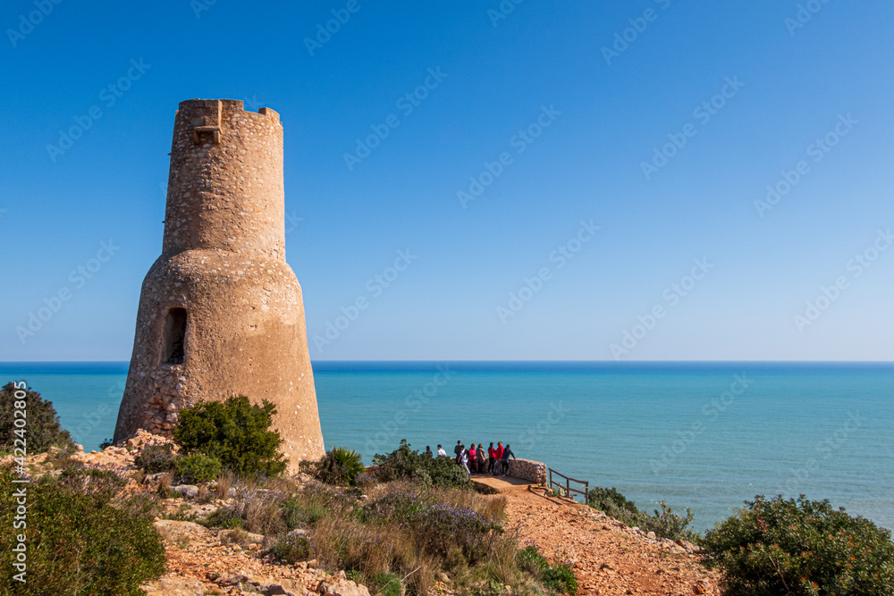 Different views of the beautiful Torre Del Gerro in Denia, with the Mediterranean Sea in the background on a clear and sunny day.