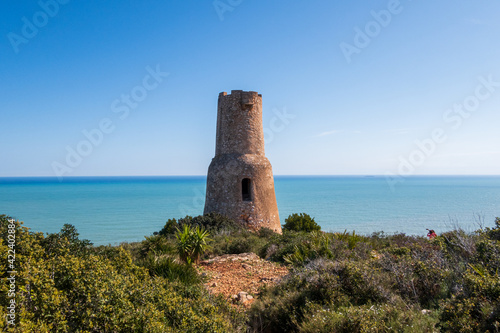 Different views of the beautiful Torre Del Gerro in Denia, with the Mediterranean Sea in the background on a clear and sunny day.