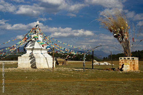 Tibetan Buddhist stupa and prayer flags, Shangri-la, Yunnan Province, China