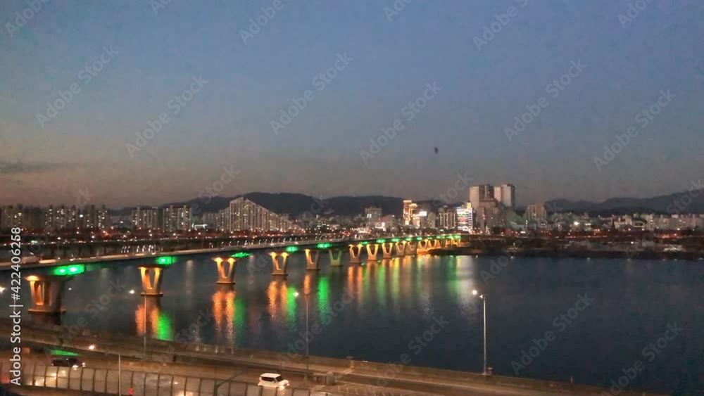 The sunset scenery of Cheonho Bridge in Seoul The waves of cars and rivers, sparkling city lights, Time Labs