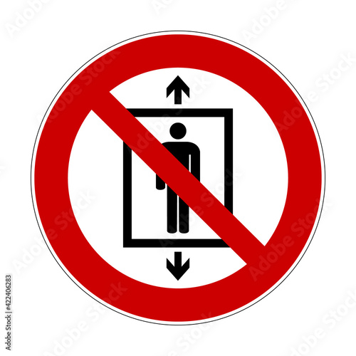 Do not use this lift for people sign. Vector illustration of red crossed out circular sign with human figure inside elevator. To prohibit use of the lift for transportation. ISO 7010 P027.