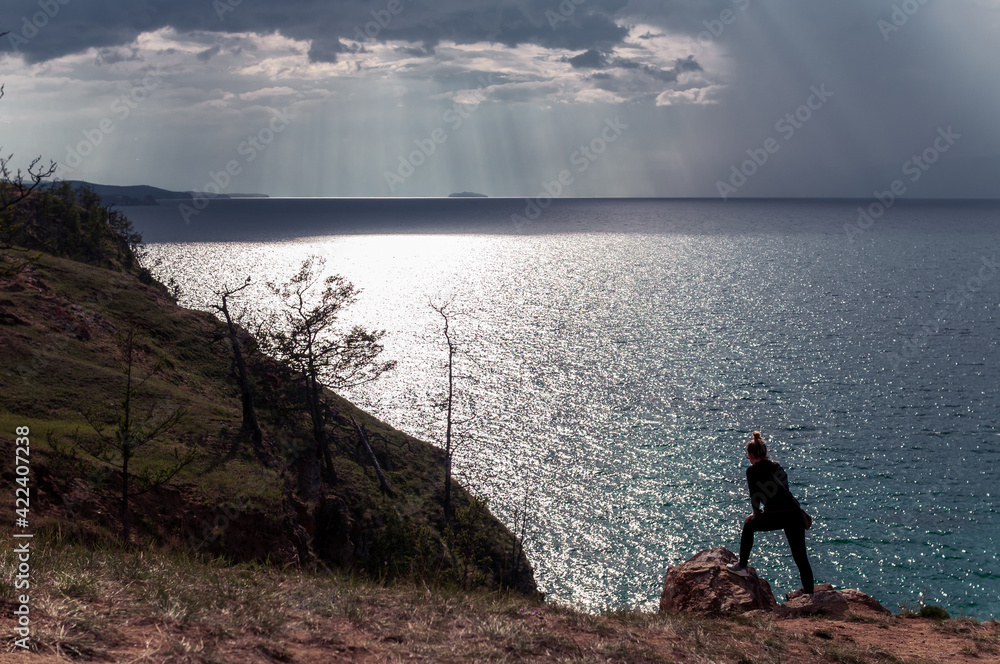 Woman looking at scenic view of Lake Baikal