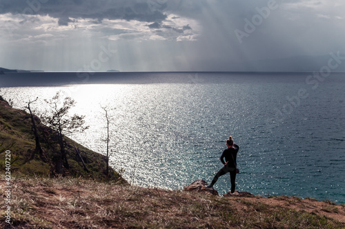 Woman looking at scenic view of Lake Baikal