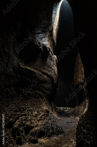 View from inside of Serracozzo volcanic cave on mount Etna, Italy photo