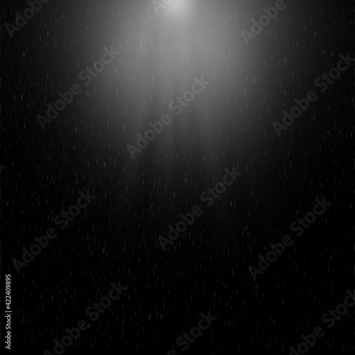 abstract background with spot white light and falling particles