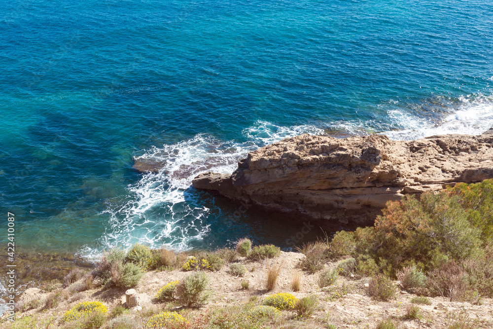Top view of cliffs, bays, clear sea - nature background