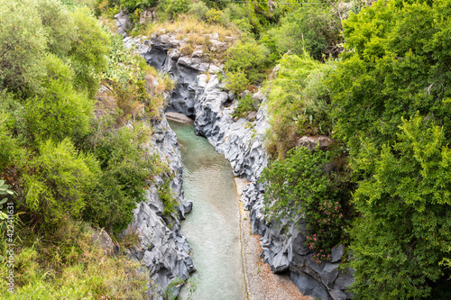 Basalt rocks and pristine water of Alcantara gorges in Sicily, Italy