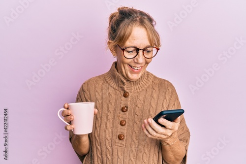 Wallpaper Mural Middle age blonde woman using smartphone and drinking a cup of coffee celebrating crazy and amazed for success with open eyes screaming excited. Torontodigital.ca