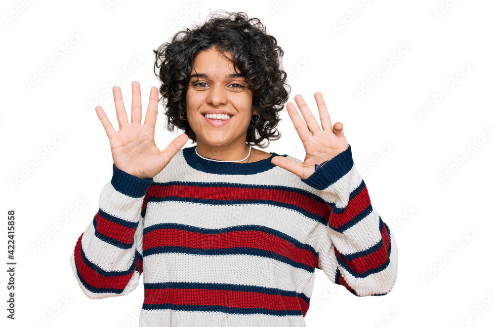 Young hispanic woman with curly hair wearing casual clothes showing and pointing up with fingers number nine while smiling confident and happy. Young hispanic woman with curly hair wearing casual clothes showing and pointing up with fingers number nine while smiling confident and happy.