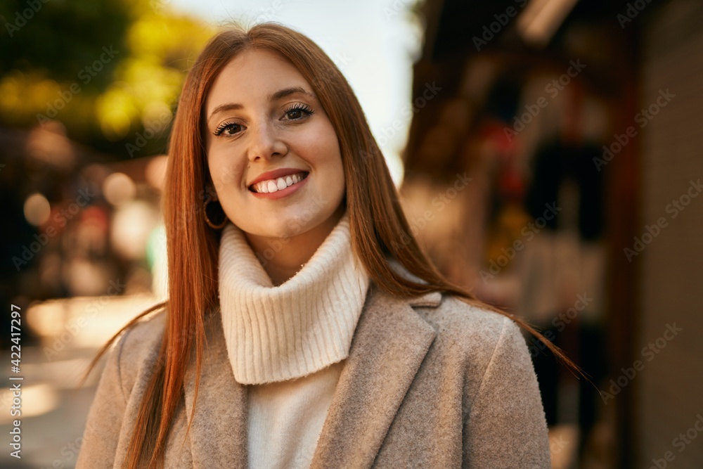 Young redhead girl smiling happy standing at the city. Young redhead girl smiling happy standing at the city.