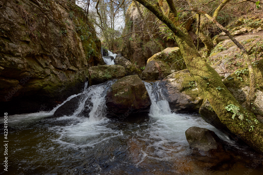Small waterfall formed by the river Teo in the area of Galicia, Spain. Small waterfall formed by the river Teo in the area of Galicia, Spain.