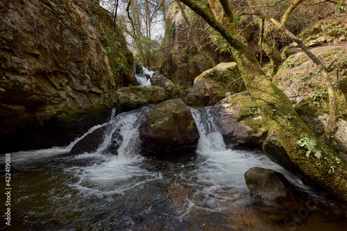 Small waterfall formed by the river Teo in the area of Galicia  Spain.