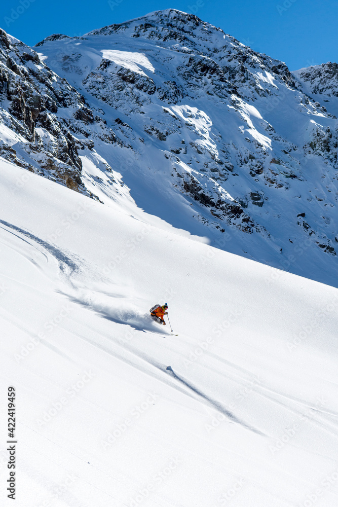 A man backcountry skiing in Velocity Basin, Cement Creek, San Juan National Forest, Silverton, Colorado. A man backcountry skiing in Velocity Basin, Cement Creek, San Juan National Forest, Silverton, Colorado.