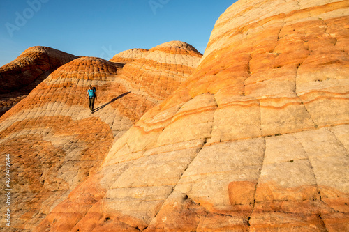 A woman hiking in the Candy Cliffs, Yant Flats, Silver Reef, Saint George, Utah. photo