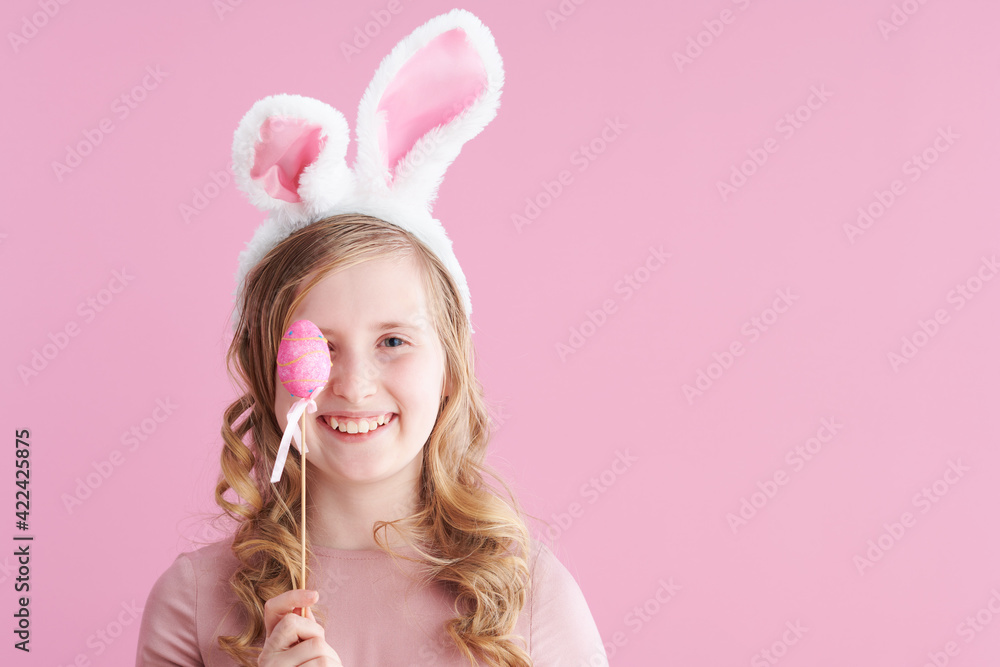 Portrait of smiling stylish child in pink dress on pink Portrait of smiling stylish child in pink dress on pink