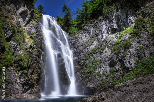 long daytime exposure of the huge waterfall of Saut deth Pish in the Aran Valley, Catalan Pyrenees, Lerida, Spain, vertical