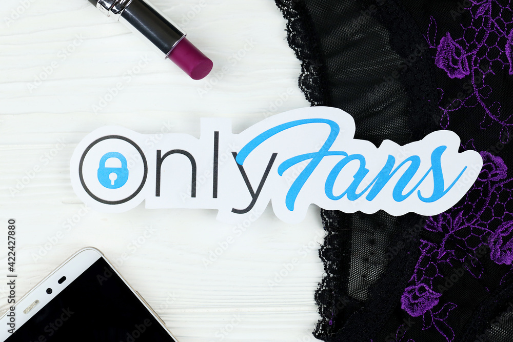 KHARKOV, UKRAINE - FEBRUARY 14, 2021: Onlyfans paper logo, red lipstick