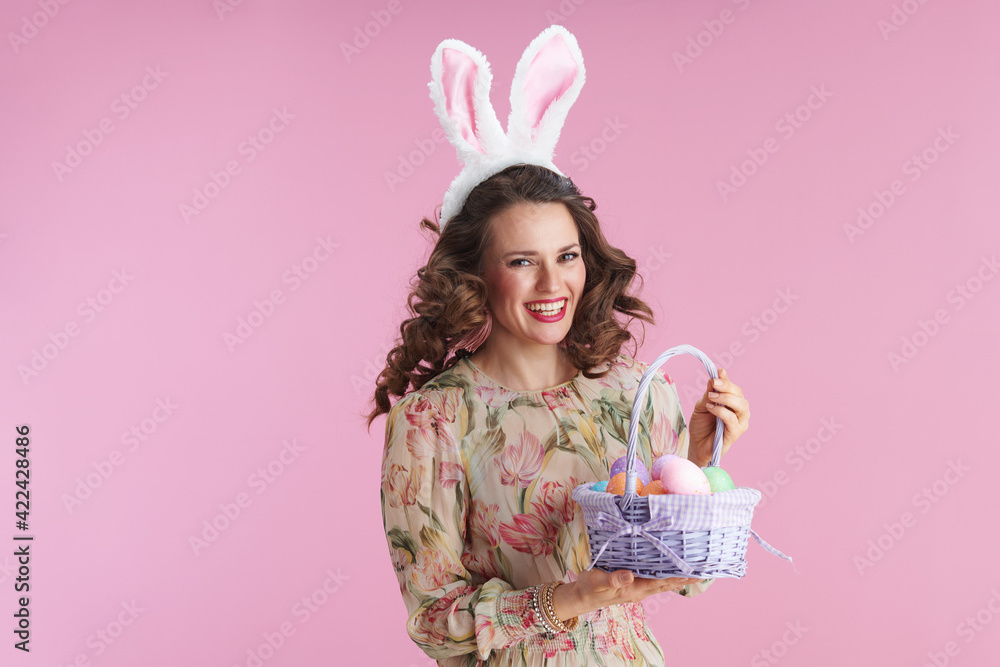 young woman with long wavy brunette hair on pink young woman with long wavy brunette hair on pink