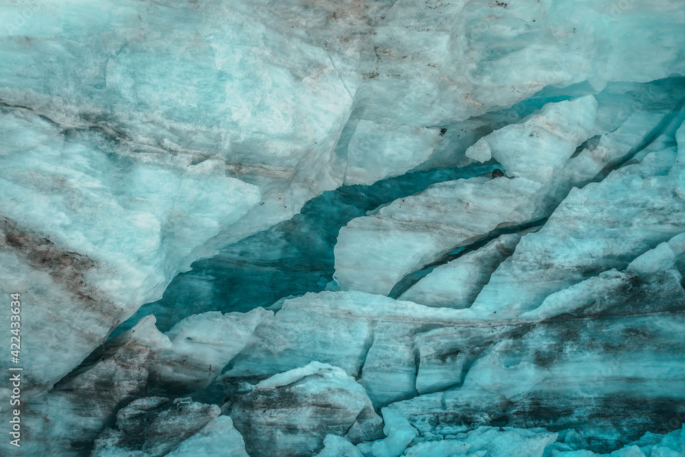 Minimalist nature background of glacier surface with cracks and