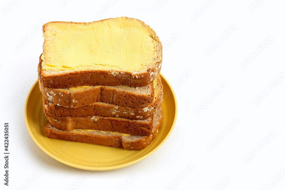 Bread slices with butter on white