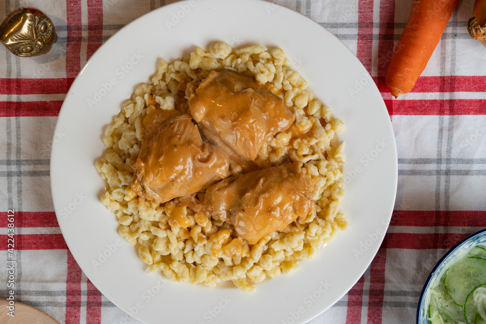 Classic chicken paprikash on a bed of Hungarian dumplings (Nokedli) Classic chicken paprikash on a bed of Hungarian dumplings (Nokedli)