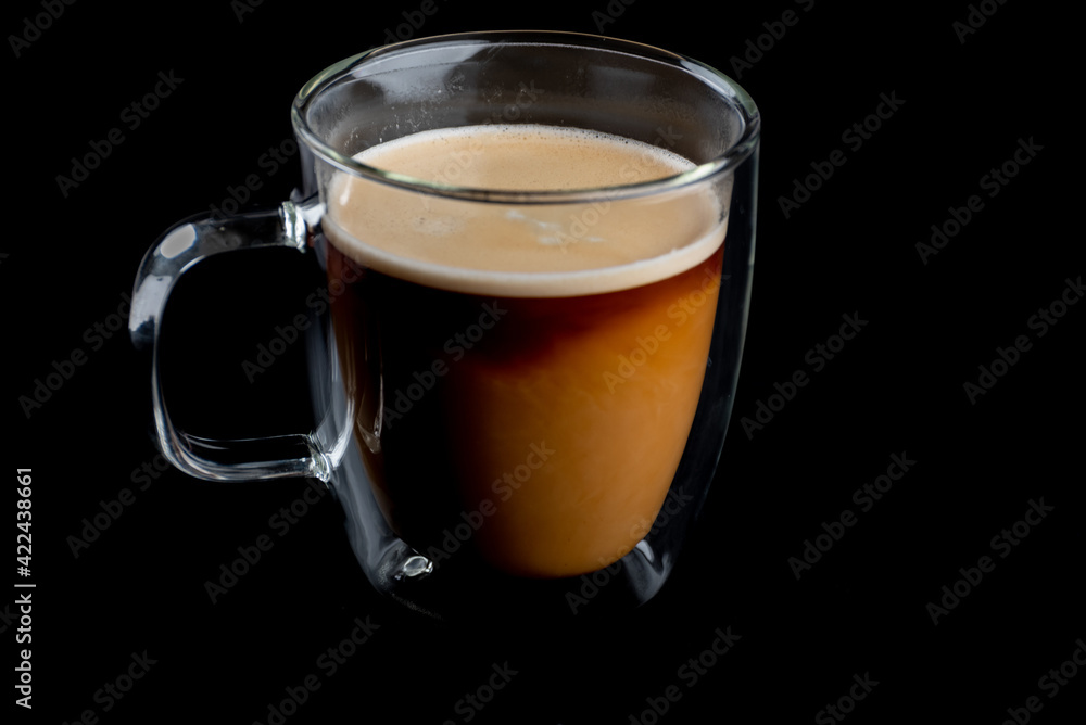 Coffee and cream in a glass mug Coffee and cream in a glass mug