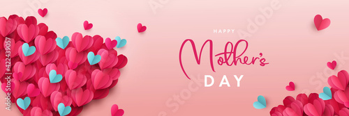 Happy Mothers Day banner. Holiday background design with big heart made of pink, red and blue Origami Hearts on soft pink background. Horizontal poster, flyer, greeting card, header for website