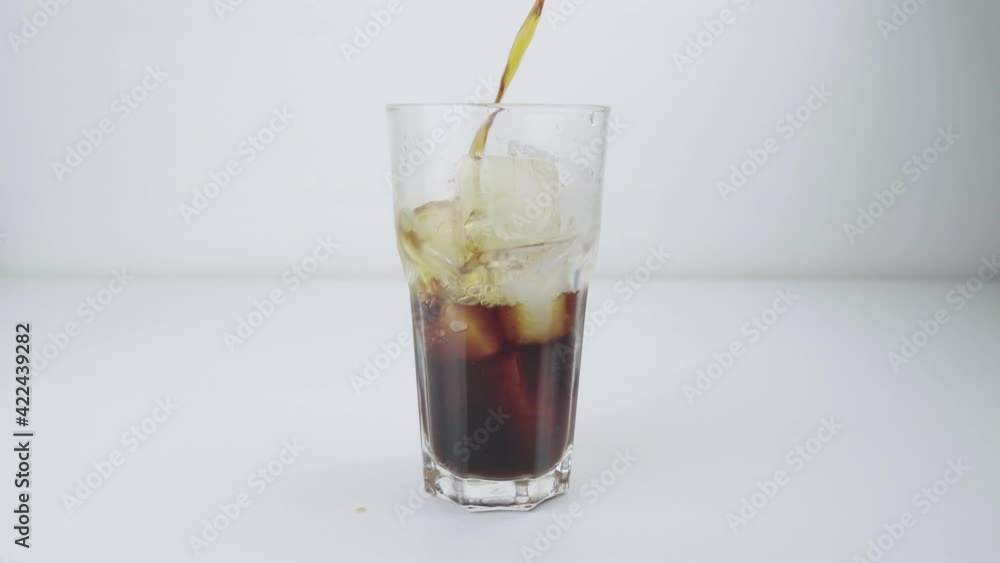 White background Pour the drip coffee on the ice, a very popular international drink, Drip coffee is to use water to pour through the ground coffee powder on a filter. White background Pour the drip coffee on the ice, a very popular international drink, Drip coffee is to use water to pour through the ground coffee powder on a filter.