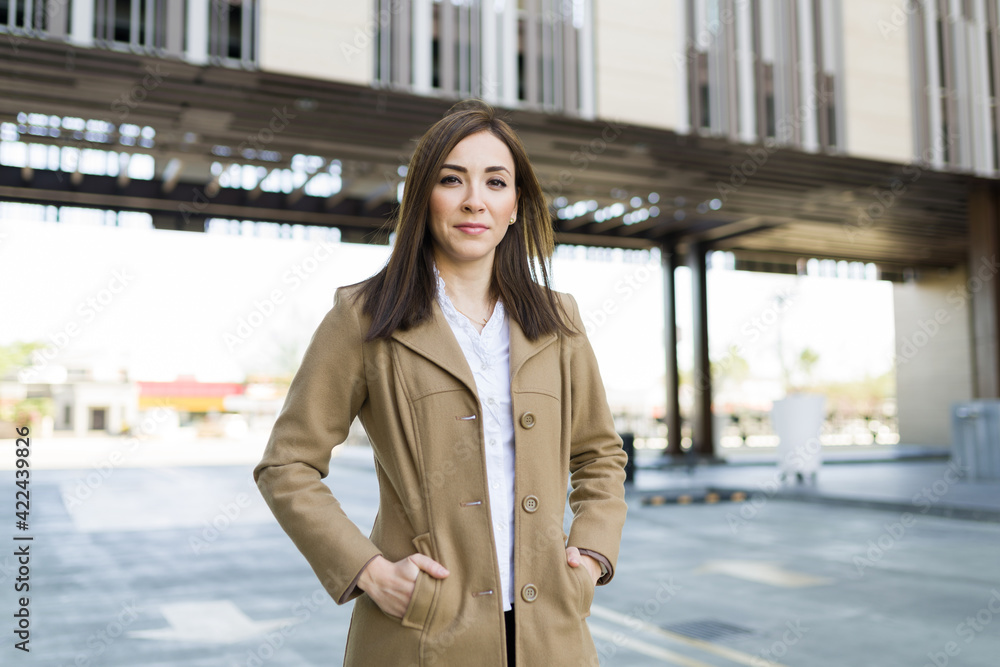 Fototapeta premium Beautiful serious businesswoman ready to go to work