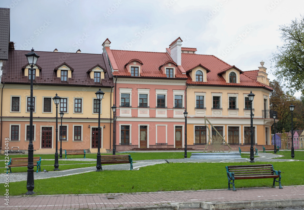 Kamenets-Podolsk  city, central place, restored houses in a modern style, green lawns and benches for the rest of the townspeople and tourists.