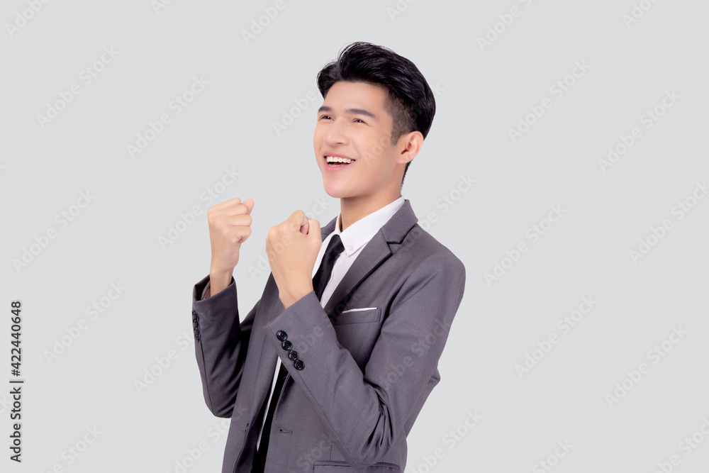 Portrait businessman in suit standing with win success isolated on white background, young asian business man is manager or executive having confident and excited is positive, expression and emotion. Portrait businessman in suit standing with win success isolated on white background, young asian business man is manager or executive having confident and excited is positive, expression and emotion.