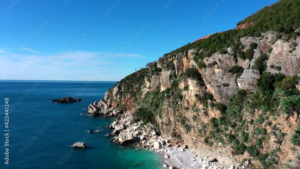 Fly over the sea overlooking a bushy mountain Fly over the sea overlooking a bushy mountain